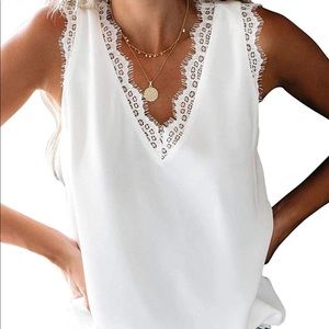 White sleeveless blouse with lace trim